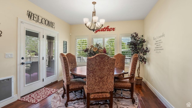 336 S 1400 W, Farmington, UT 84025 - dining room with a chandelier, dark wood finished floors, and baseboards