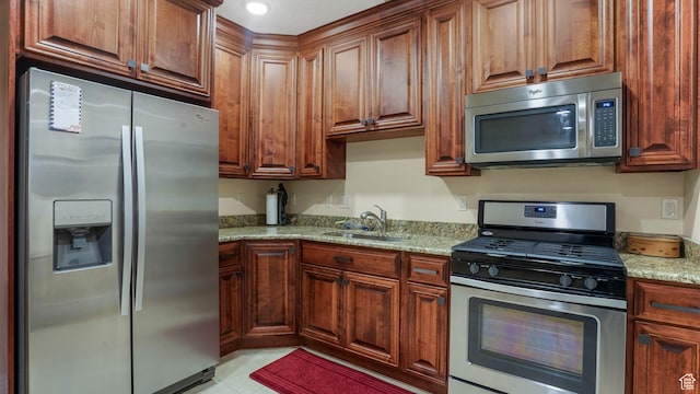 336 S 1400 W, Farmington, UT 84025 - kitchen with appliances with stainless steel finishes, a sink, light stone countertops, light tile patterned floors, and recessed lighting