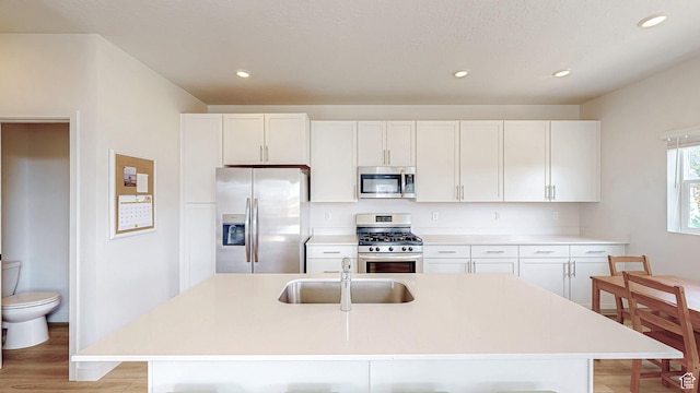 585 W 1420 S, Spanish Fork, UT 84660 - kitchen with stainless steel appliances, a sink, white cabinetry, recessed lighting, and light countertops