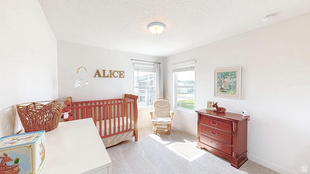 585 W 1420 S, Spanish Fork, UT 84660 - bedroom featuring light carpet, a textured ceiling, baseboards, and a crib