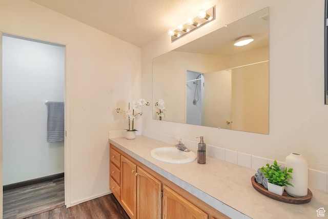 783 S 100 W, Payson, UT 84651 - bathroom featuring wood finished floors, vanity, a shower, and baseboards