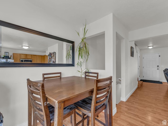 1177 W Dun Robin Ct, Salt Lake City, UT 84123 - dining room with baseboards and light wood-style flooring