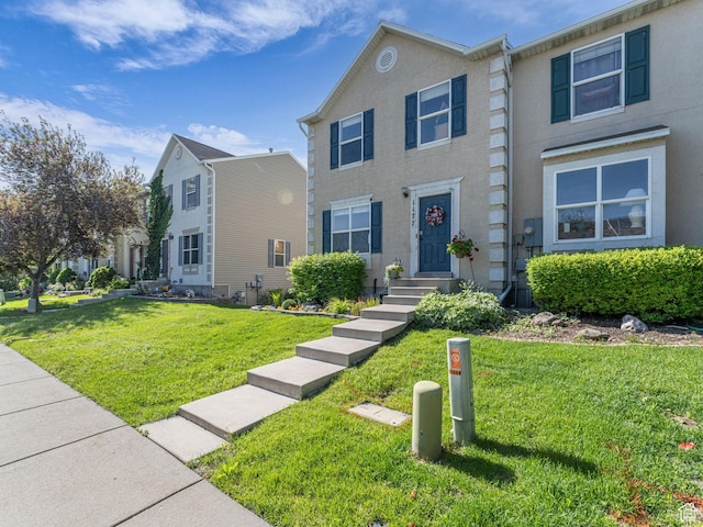 1177 W Dun Robin Ct, Salt Lake City, UT 84123 - view of property with a front yard and stucco siding