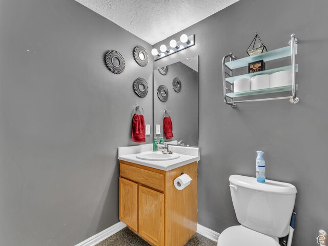 1177 W Dun Robin Ct, Salt Lake City, UT 84123 - bathroom featuring vanity, toilet, a textured ceiling, and baseboards
