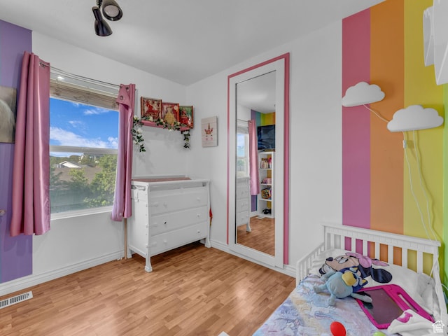 1177 W Dun Robin Ct, Salt Lake City, UT 84123 - bedroom featuring light wood-style flooring and baseboards