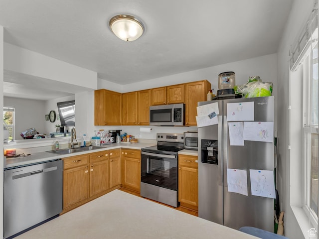 1177 W Dun Robin Ct, Salt Lake City, UT 84123 - kitchen with stainless steel appliances, a sink, and light countertops