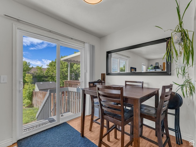 1177 W Dun Robin Ct, Salt Lake City, UT 84123 - dining space with healthy amount of natural light and wood finished floors