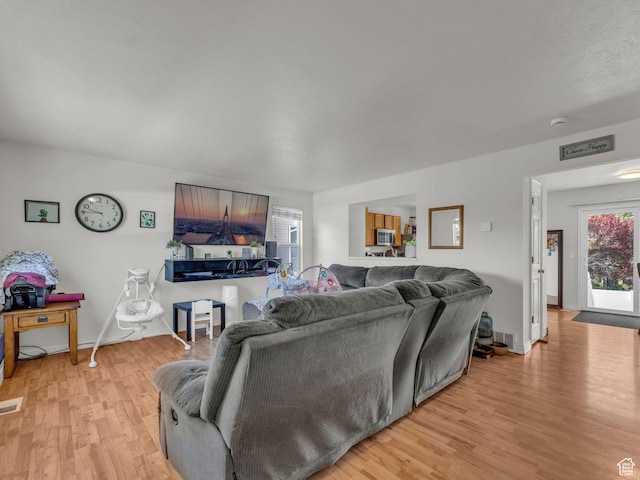 1177 W Dun Robin Ct, Salt Lake City, UT 84123 - living area with light wood finished floors and baseboards