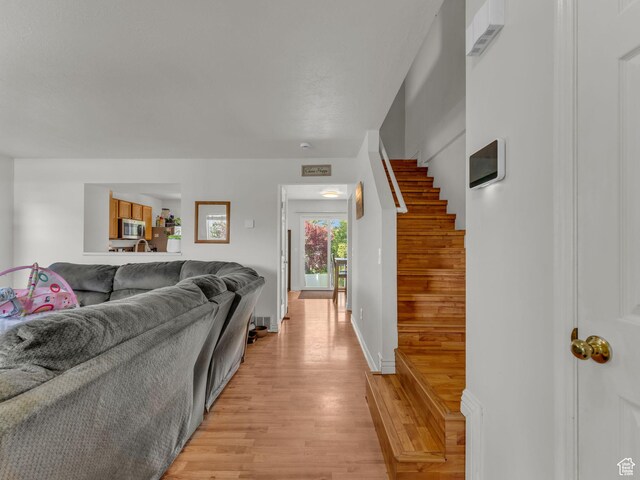 1177 W Dun Robin Ct, Salt Lake City, UT 84123 - living room with light wood-style flooring and stairs