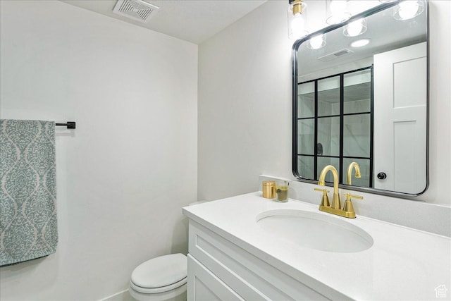 669 W 6th Ave, Midvale, UT 84047 - bathroom featuring toilet, vanity, and a shower