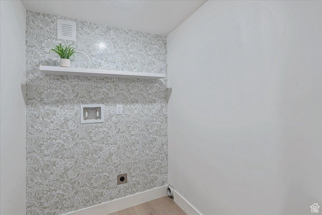 669 W 6th Ave, Midvale, UT 84047 - laundry area with wallpapered walls, electric dryer hookup, hookup for a washing machine, baseboards, and wood finished floors