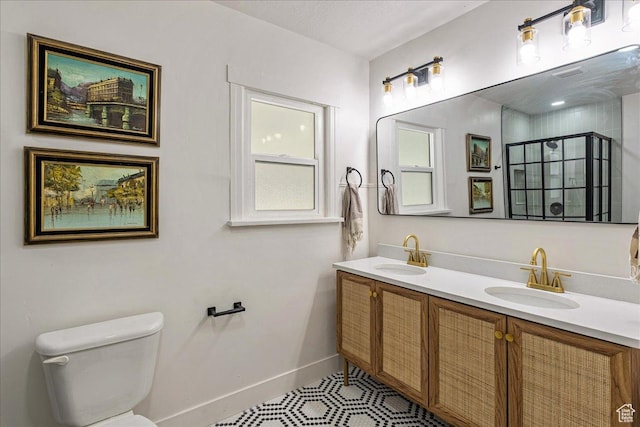 669 W 6th Ave, Midvale, UT 84047 - full bath featuring double vanity, toilet, baseboards, a shower stall, and tile patterned floors