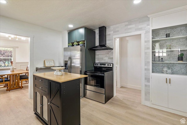 669 W 6th Ave, Midvale, UT 84047 - kitchen featuring wall chimney exhaust hood, stainless steel appliances, light wood-type flooring, light countertops, and recessed lighting