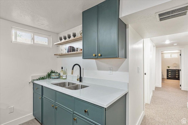 669 W 6th Ave, Midvale, UT 84047 - kitchen featuring a sink, baseboards, light countertops, green cabinetry, and a textured ceiling