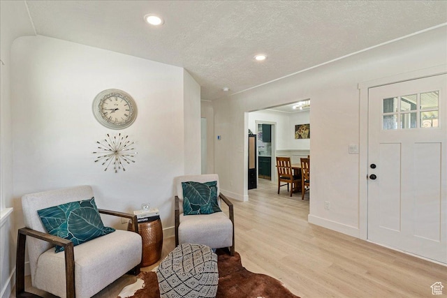 669 W 6th Ave, Midvale, UT 84047 - sitting room with light wood-style flooring, a textured ceiling, baseboards, and recessed lighting