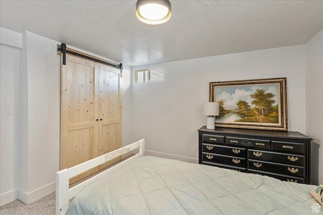 669 W 6th Ave, Midvale, UT 84047 - carpeted bedroom featuring baseboards and a barn door