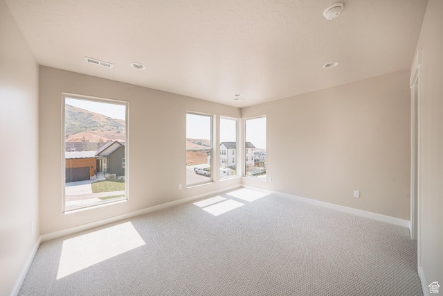 1651 W Canyon Rim Rd Unit 633, Lehi, UT 84043 - carpeted empty room with baseboards, plenty of natural light, a smoke detector, and recessed lighting