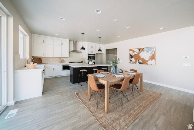 1651 W Canyon Rim Rd Unit 633, Lehi, UT 84043 - dining space with light wood-type flooring, recessed lighting, and baseboards