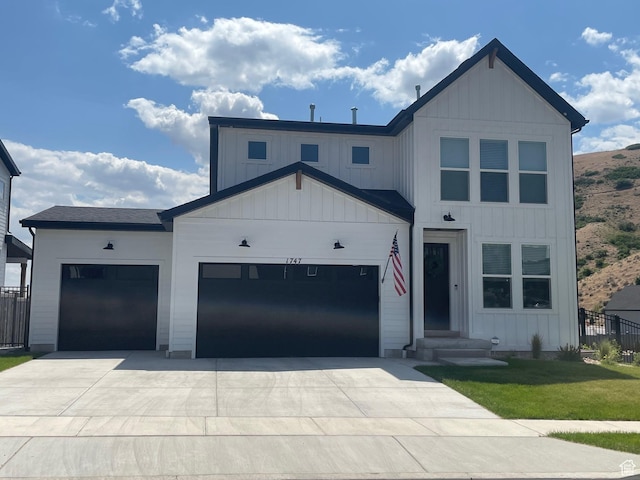 1651 W Canyon Rim Rd Unit 633, Lehi, UT 84043 - modern inspired farmhouse featuring an attached garage, driveway, and board and batten siding