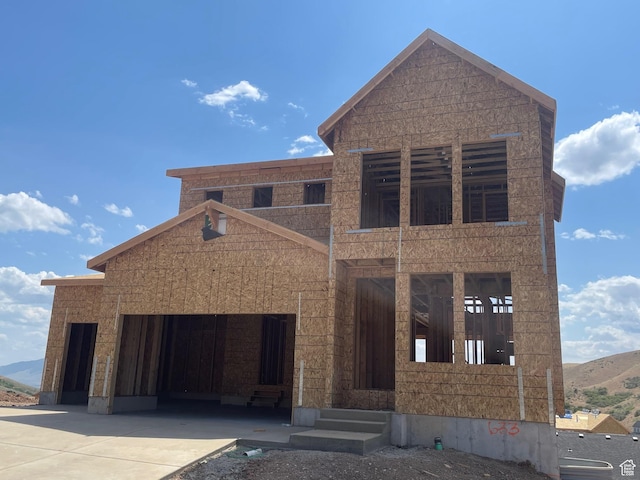 1651 W Canyon Rim Rd Unit 633, Lehi, UT 84043 - unfinished property featuring concrete driveway, an attached garage, and a mountain view