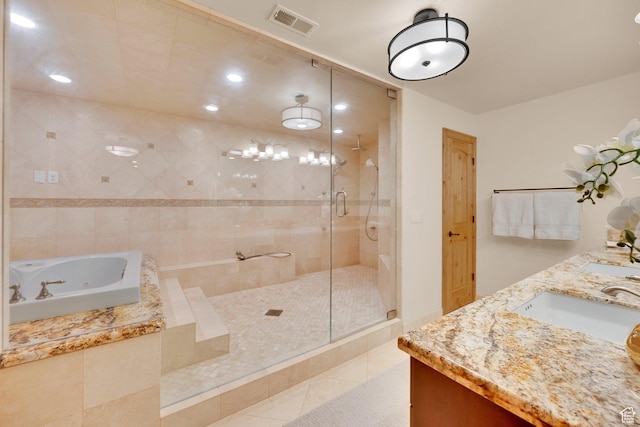 2345 E Lambourne Ave, Millcreek, UT 84109 - full bathroom with a shower stall, a tub with jets, double vanity, tile patterned floors, and recessed lighting