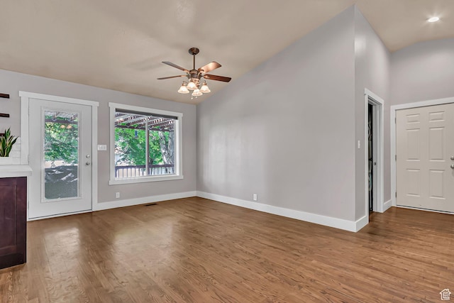 850 E 760 N, Lehi, UT 84043 - unfurnished living room featuring baseboards, wood finished floors, ceiling fan, and vaulted ceiling
