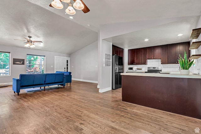 850 E 760 N, Lehi, UT 84043 - kitchen featuring fridge with ice dispenser, a ceiling fan, stainless steel range with electric stovetop, light countertops, and lofted ceiling