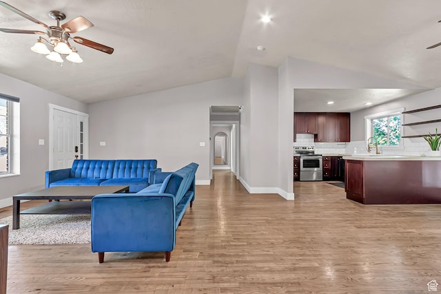 850 E 760 N, Lehi, UT 84043 - living room with lofted ceiling, ceiling fan, light wood-style flooring, baseboards, and recessed lighting