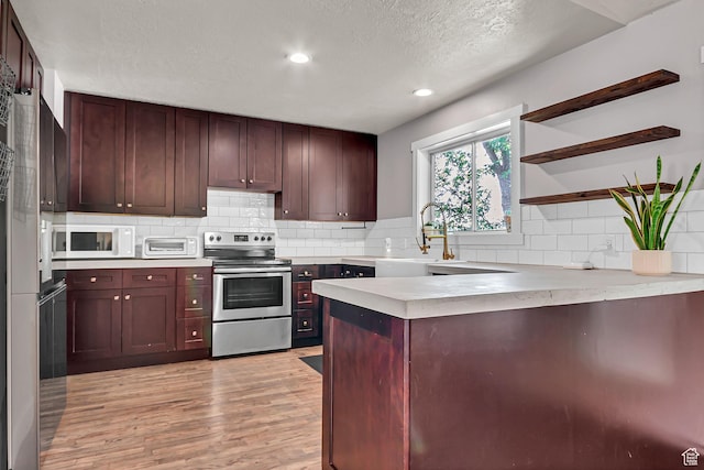 850 E 760 N, Lehi, UT 84043 - kitchen with stainless steel range with electric stovetop, a sink, open shelves, a peninsula, and white microwave