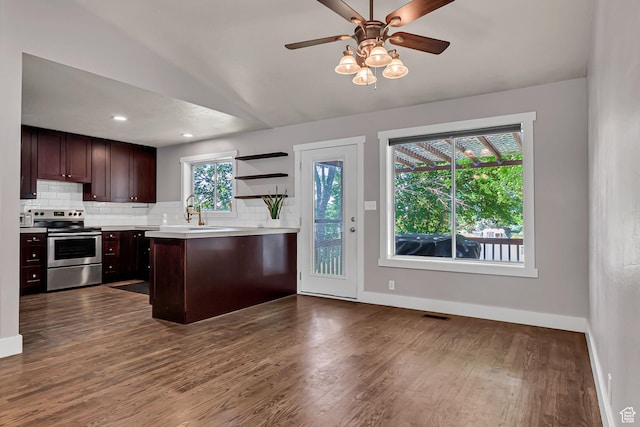 850 E 760 N, Lehi, UT 84043 - kitchen featuring stainless steel range with electric stovetop, backsplash, baseboards, lofted ceiling, and light countertops