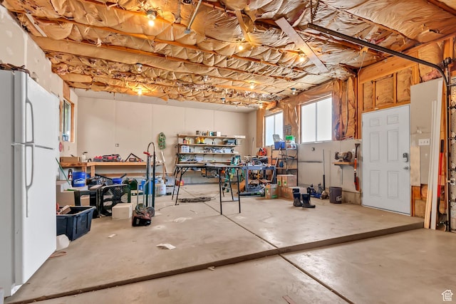 850 E 760 N, Lehi, UT 84043 - basement featuring freestanding refrigerator, a workshop area, and a garage