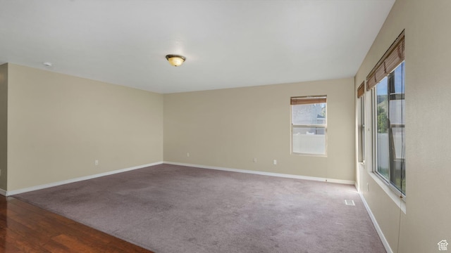 13764 S Rosie Ln, Herriman, UT 84096 - carpeted spare room with baseboards and wood finished floors