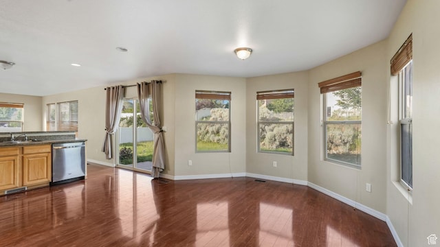 13764 S Rosie Ln, Herriman, UT 84096 - kitchen featuring dishwasher, baseboards, dark countertops, plenty of natural light, and recessed lighting