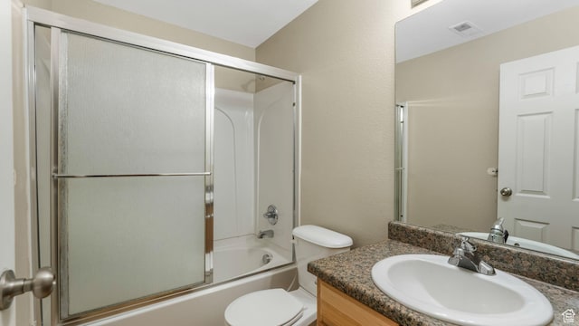 13764 S Rosie Ln, Herriman, UT 84096 - bathroom featuring vanity, combined bath / shower with glass door, and toilet