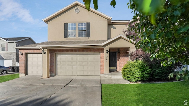 13764 S Rosie Ln, Herriman, UT 84096 - traditional-style house featuring brick siding, an attached garage, concrete driveway, a front yard, and stucco siding