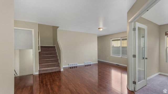 13764 S Rosie Ln, Herriman, UT 84096 - unfurnished living room featuring wood finished floors, baseboards, and stairs