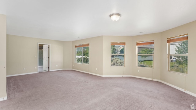 13764 S Rosie Ln, Herriman, UT 84096 - carpeted empty room featuring plenty of natural light and baseboards