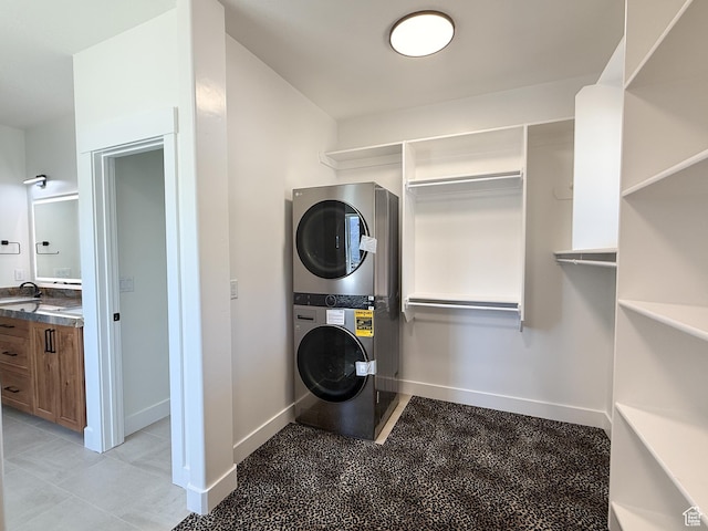 1141 E 4100 N, North Ogden, UT 84414 - laundry room with stacked washer and clothes dryer and baseboards