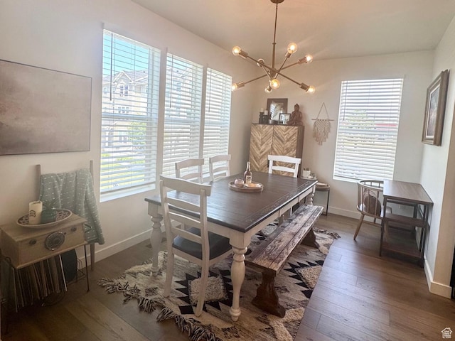 953 N 850 E Unit 229, Layton, UT 84041 - dining space featuring a chandelier, hardwood / wood-style floors, and baseboards