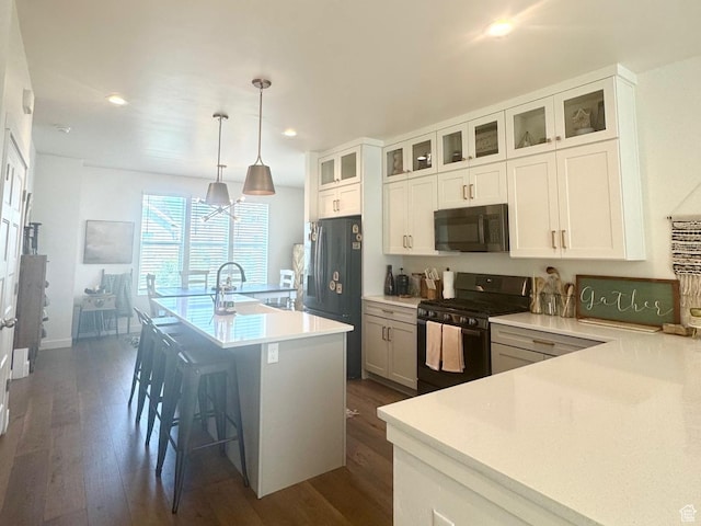 953 N 850 E Unit 229, Layton, UT 84041 - kitchen with black appliances, dark wood-style floors, a sink, recessed lighting, and light countertops