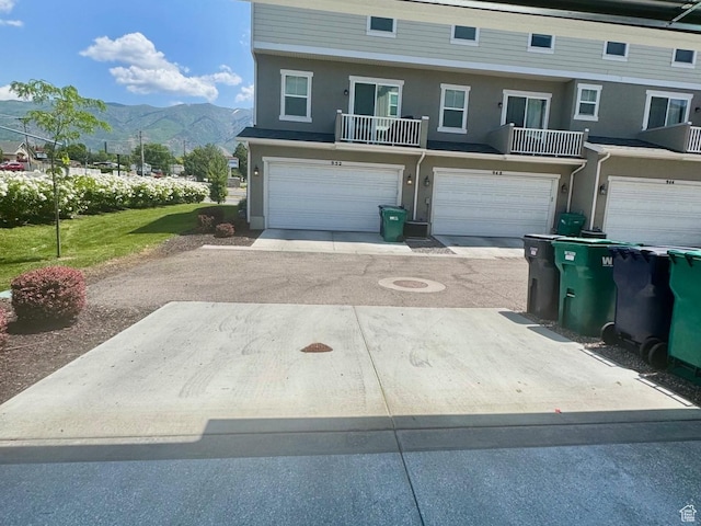 953 N 850 E Unit 229, Layton, UT 84041 - townhome / multi-family property featuring a mountain view, a garage, driveway, and stucco siding