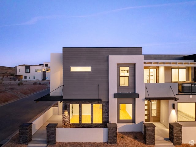 712 W Coastline Pl, St George, UT 84790 - view of front of house with a balcony, stucco siding, and stone siding