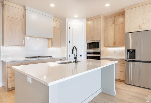 712 W Coastline Pl, St George, UT 84790 - kitchen with appliances with stainless steel finishes, a sink, light brown cabinetry, light countertops, and recessed lighting