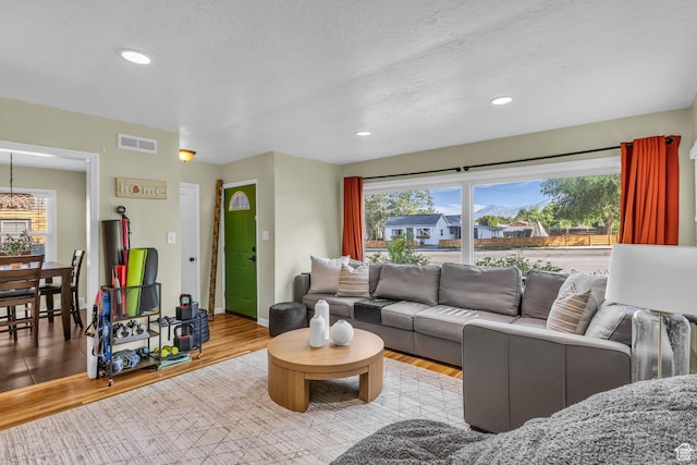 954 E 300 S, Provo, UT 84606 - living area featuring wood finished floors, baseboards, recessed lighting, and a chandelier