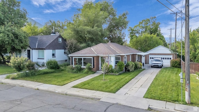 954 E 300 S, Provo, UT 84606 - bungalow-style home featuring a front yard, driveway, a garage, brick siding, and roof with shingles