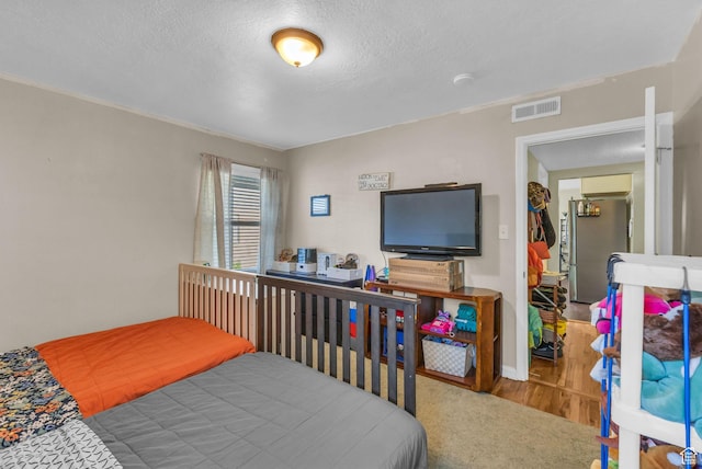 954 E 300 S, Provo, UT 84606 - bedroom featuring a textured ceiling and wood finished floors