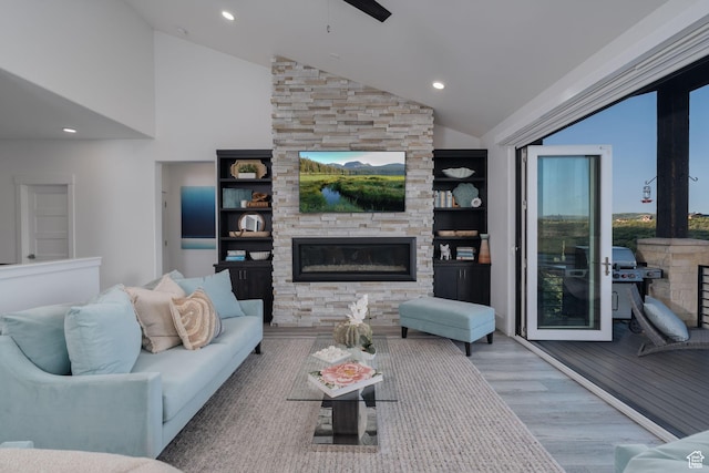 11103 N Shoreline Dr Unit # 3, Hideout, UT 84036 - living area featuring a stone fireplace, wood finished floors, high vaulted ceiling, and recessed lighting