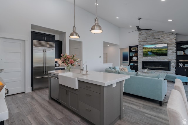 11103 N Shoreline Dr Unit # 3, Hideout, UT 84036 - kitchen with stainless steel appliances, a sink, gray cabinets, ceiling fan, and light countertops