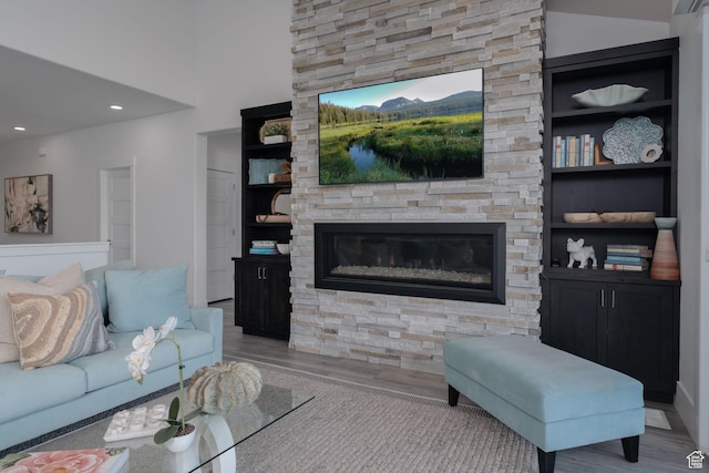11103 N Shoreline Dr Unit # 3, Hideout, UT 84036 - living area with wood finished floors, a fireplace, built in shelves, and recessed lighting