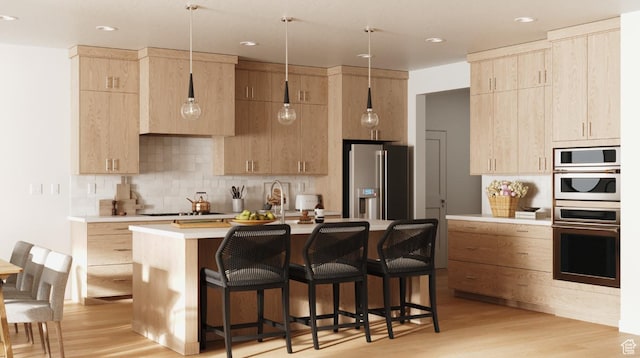 0, Washington, UT 84780 - kitchen with light brown cabinetry, appliances with stainless steel finishes, light countertops, a kitchen breakfast bar, and recessed lighting